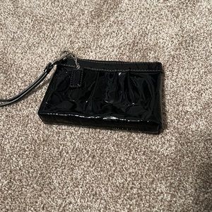 Coach black vinyl wristlet. Embossed with logo